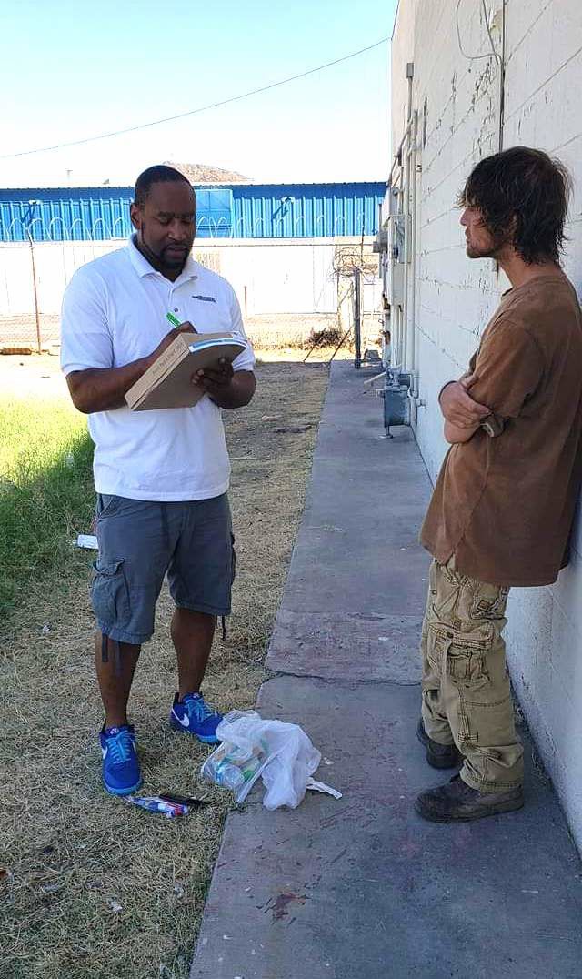 Blu Mitchell talking to someone outside